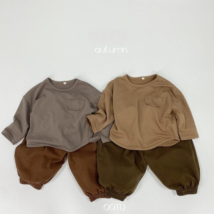 A pair of baby solid color pants in various colors, showcasing their loose and comfy design suitable for both boys and girls.