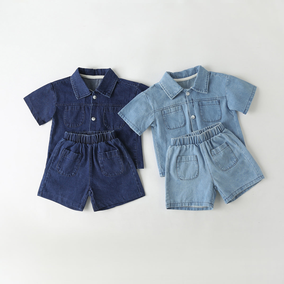 Baby wearing a solid color button front denim shirt and shorts set in blue, perfect for summer outings.