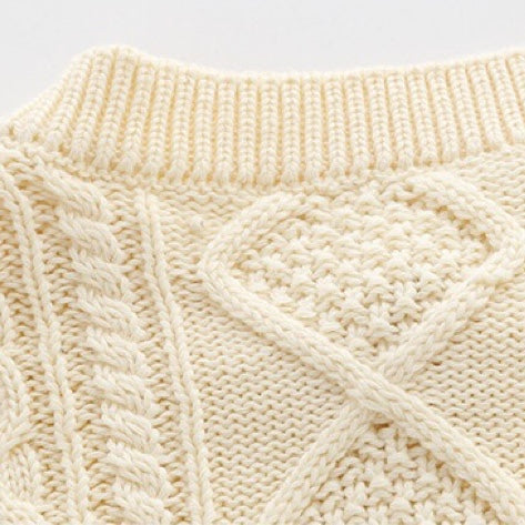 A soft crochet knitted baby cardigan in solid colors, featuring a single breasted design, perfect for both baby boys and girls.
