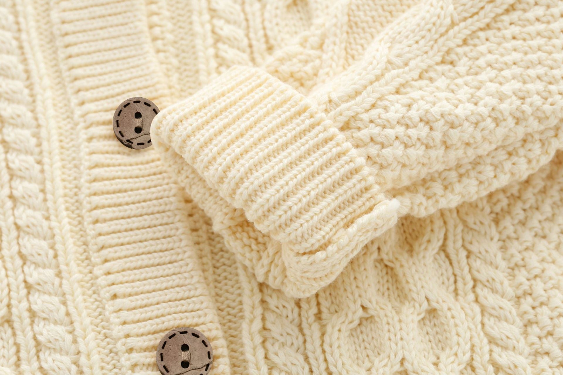 A soft crochet knitted baby cardigan in solid colors, featuring a single breasted design, perfect for both baby boys and girls.