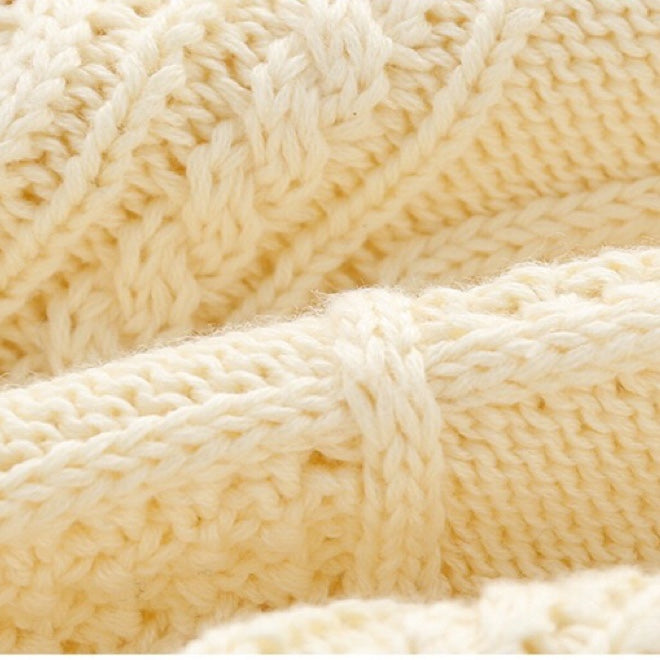 A soft crochet knitted baby cardigan in solid colors, featuring a single breasted design, perfect for both baby boys and girls.