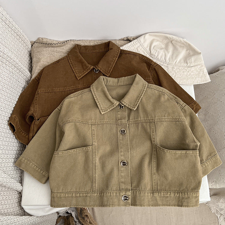 A stylish baby denim jacket in khaki and brown colors, showcasing a cool Japan style design suitable for both boys and girls.