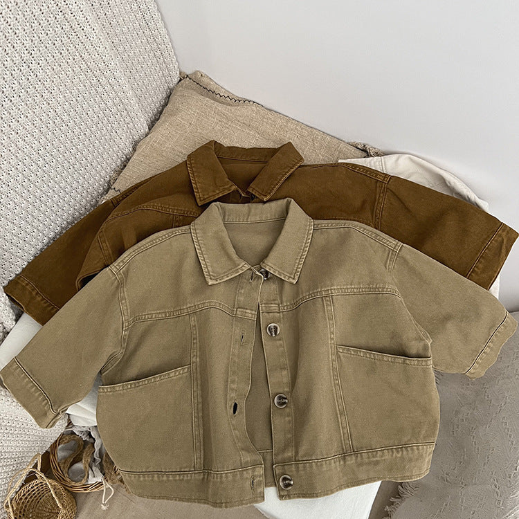 A stylish baby denim jacket in khaki and brown colors, showcasing a cool Japan style design suitable for both boys and girls.