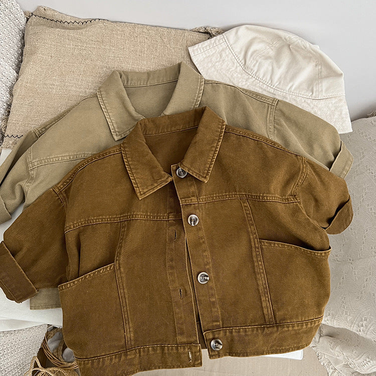 A stylish baby denim jacket in khaki and brown colors, showcasing a cool Japan style design suitable for both boys and girls.