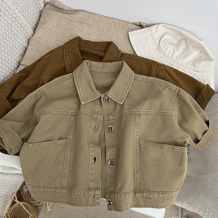 A stylish baby denim jacket in khaki and brown colors, showcasing a cool Japan style design suitable for both boys and girls.