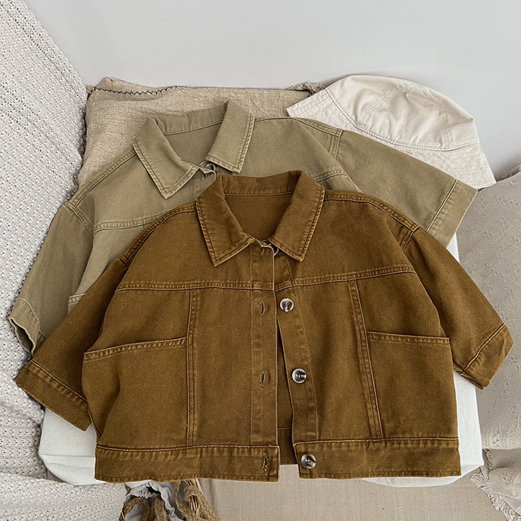 A stylish baby denim jacket in khaki and brown colors, showcasing a cool Japan style design suitable for both boys and girls.