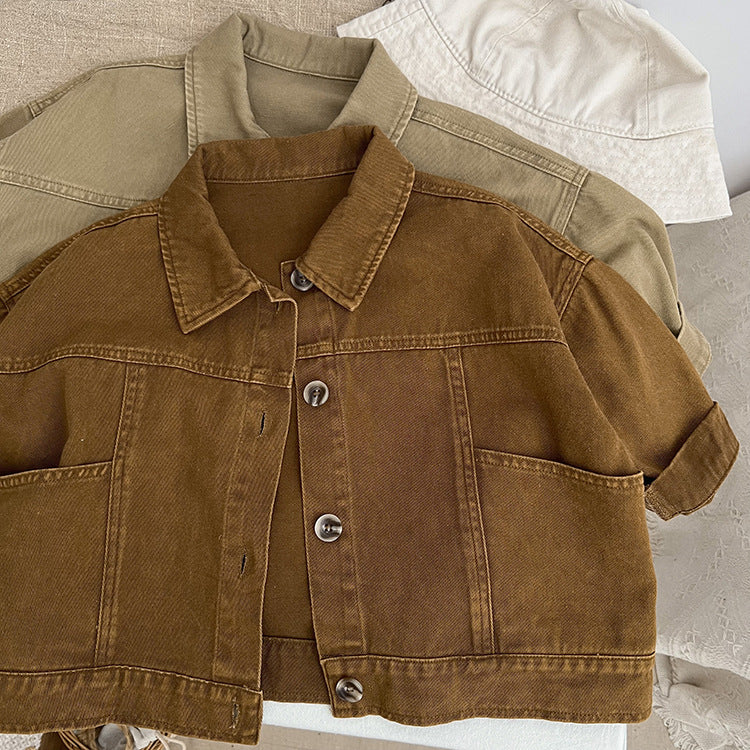 A stylish baby denim jacket in khaki and brown colors, showcasing a cool Japan style design suitable for both boys and girls.