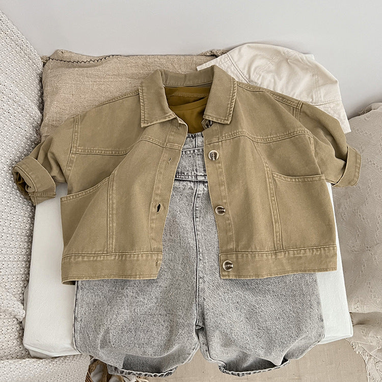 A stylish baby denim jacket in khaki and brown colors, showcasing a cool Japan style design suitable for both boys and girls.