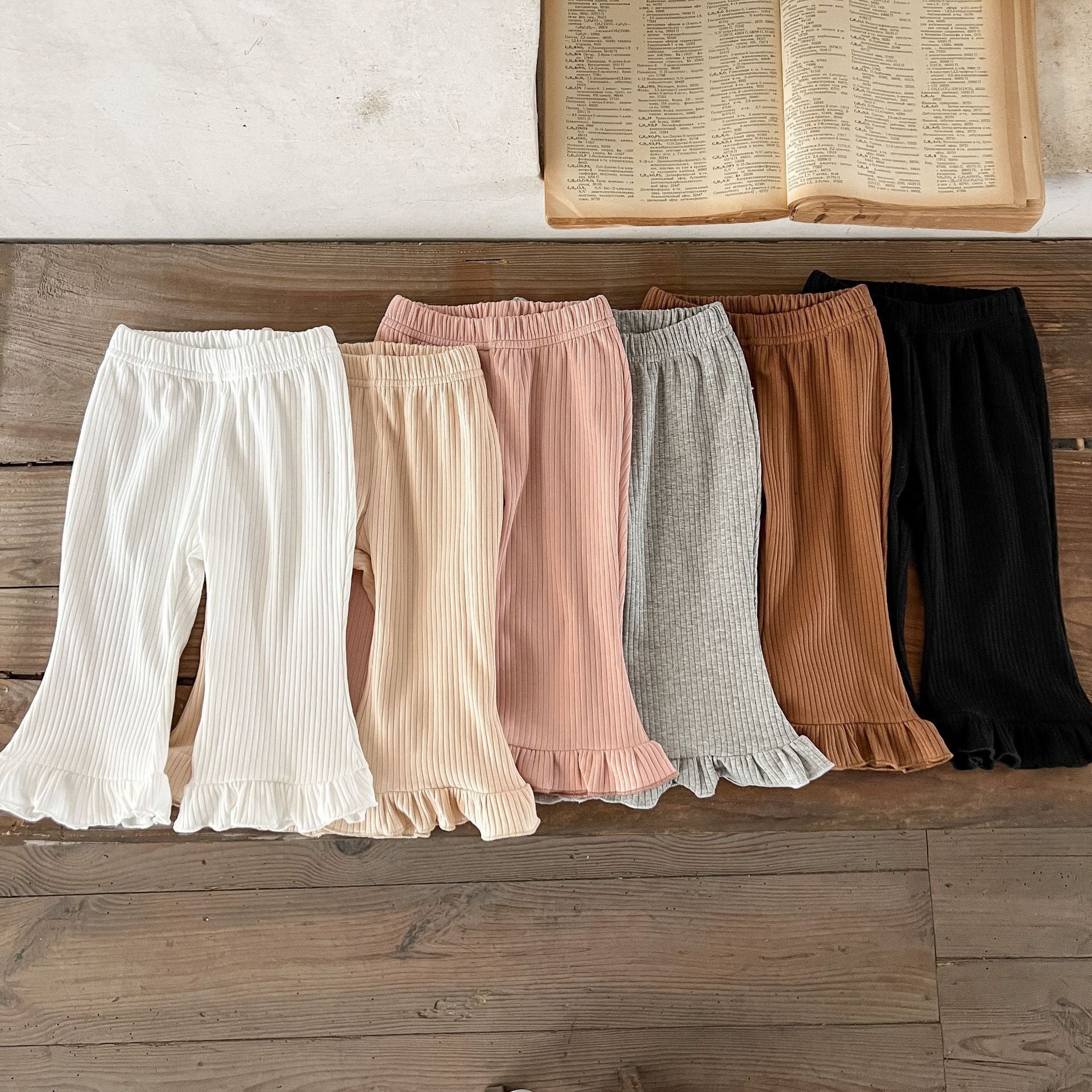 Baby Solid Color Elastic Cotton Comfy Flared Pants in various colors, showcasing the soft fabric and flared design.