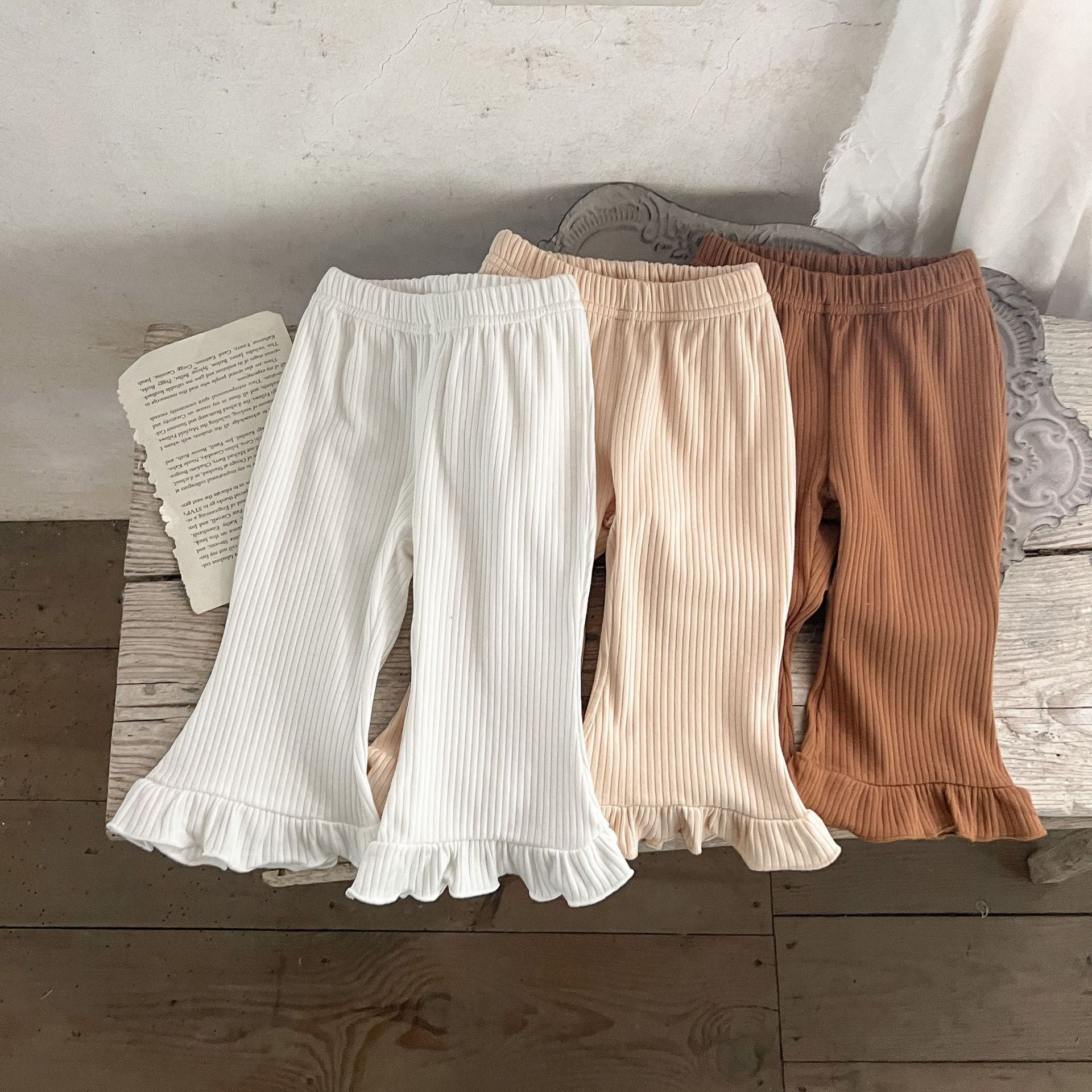 Baby Solid Color Elastic Cotton Comfy Flared Pants in various colors, showcasing the soft fabric and flared design.