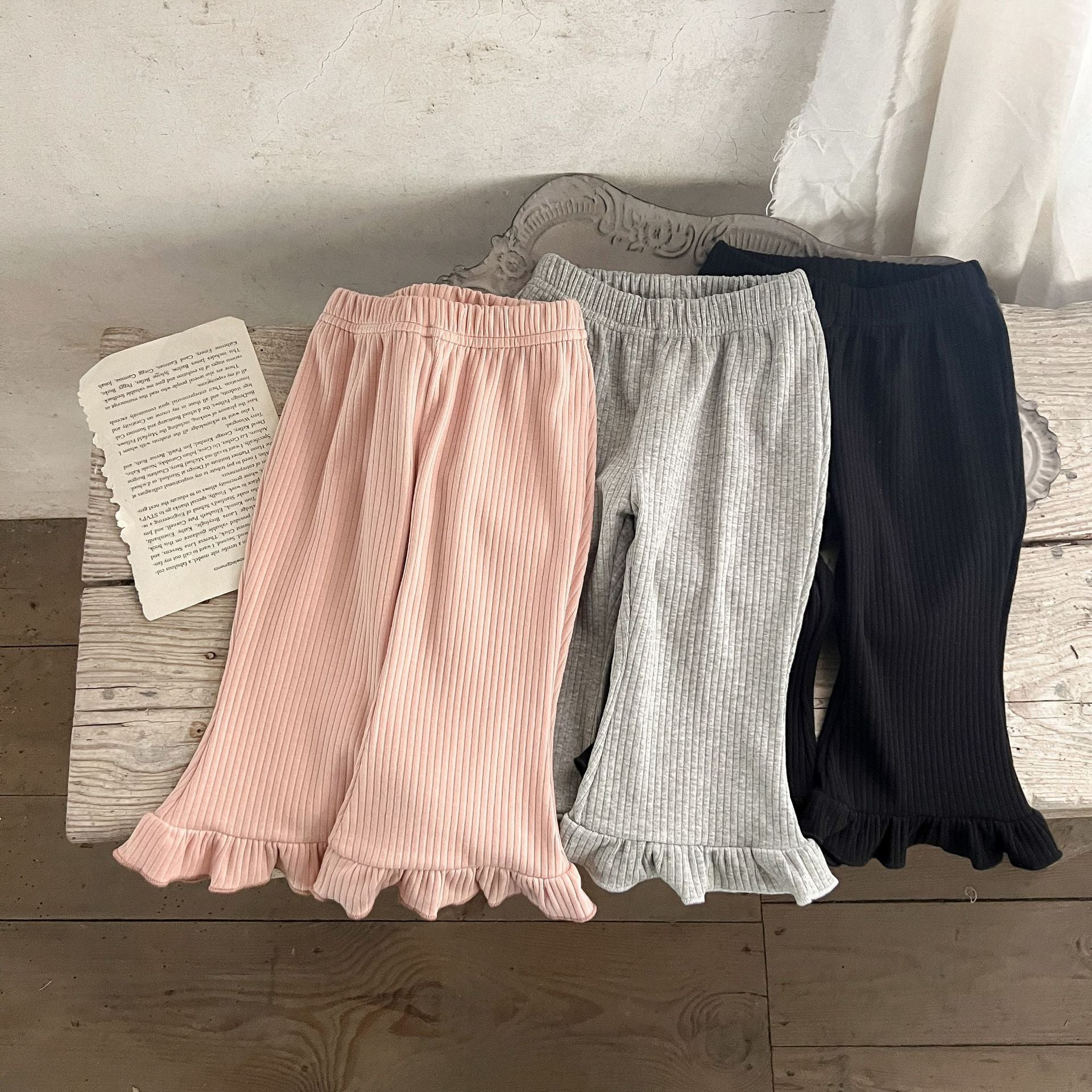 Baby Solid Color Elastic Cotton Comfy Flared Pants in various colors, showcasing the soft fabric and flared design.