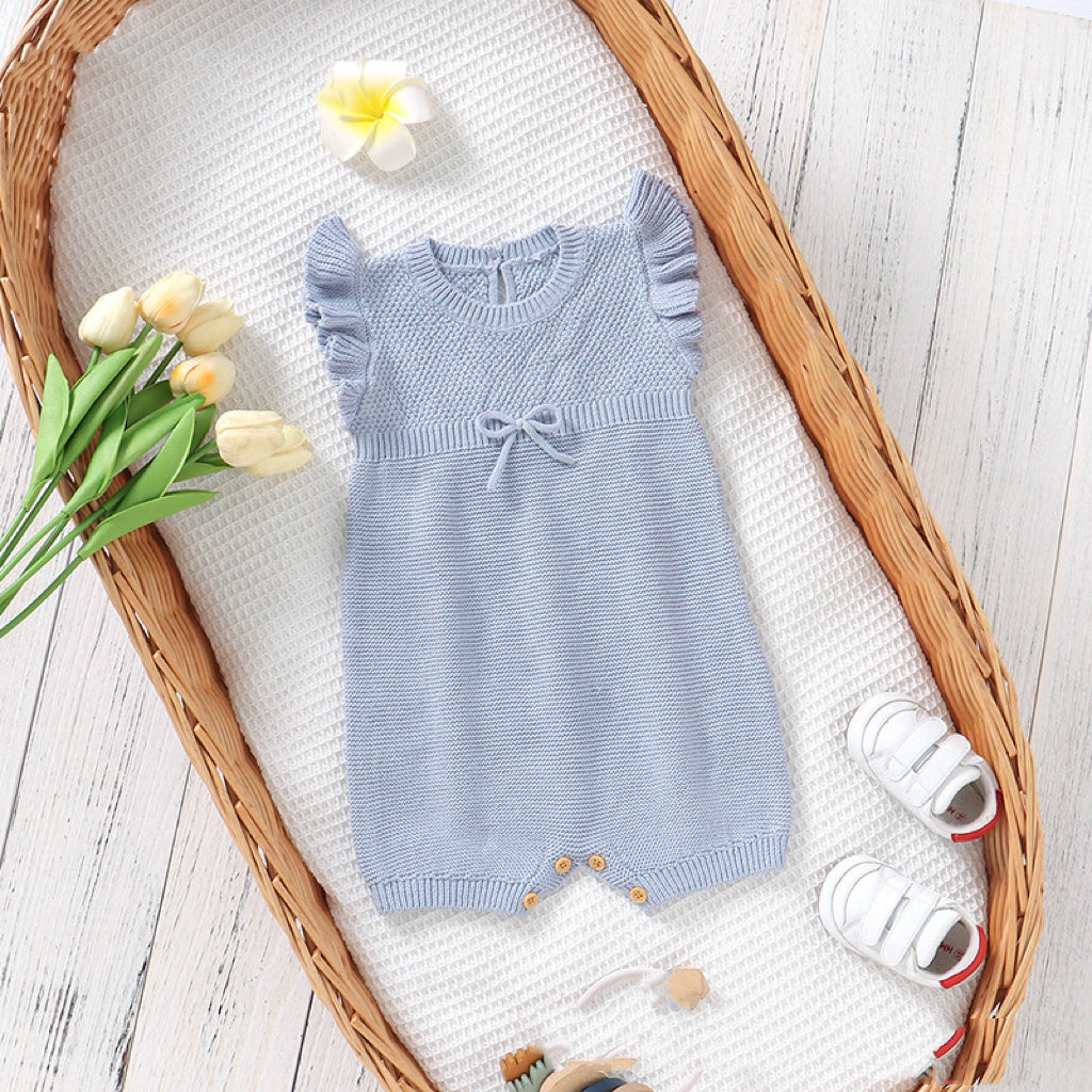 Baby Solid Color Flying Sleeves Sweet Knitted Rompers in pink and blue, showcasing soft cotton fabric and stylish design.