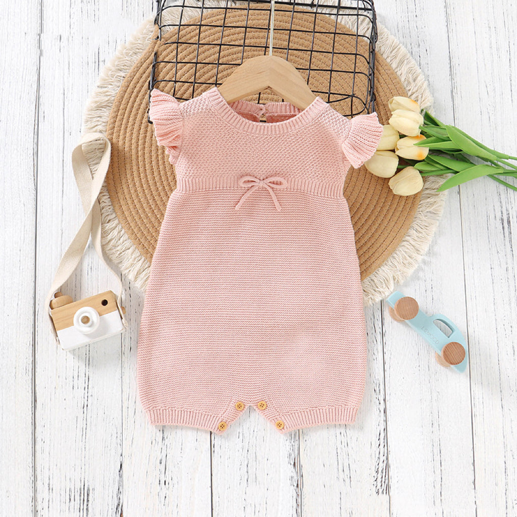 Baby Solid Color Flying Sleeves Sweet Knitted Rompers in pink and blue, showcasing soft cotton fabric and stylish design.