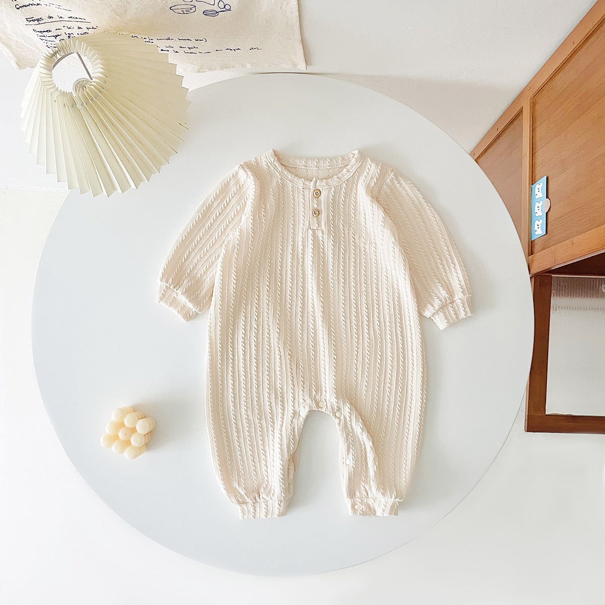 Baby Solid Color Long Sleeve Soft Cotton Romper in pink, apricot, and brown, showcasing its simple style and soft fabric.