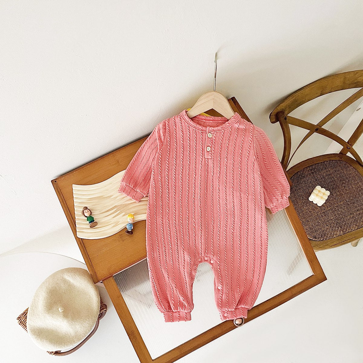 Baby Solid Color Long Sleeve Soft Cotton Romper in pink, apricot, and brown, showcasing its simple style and soft fabric.