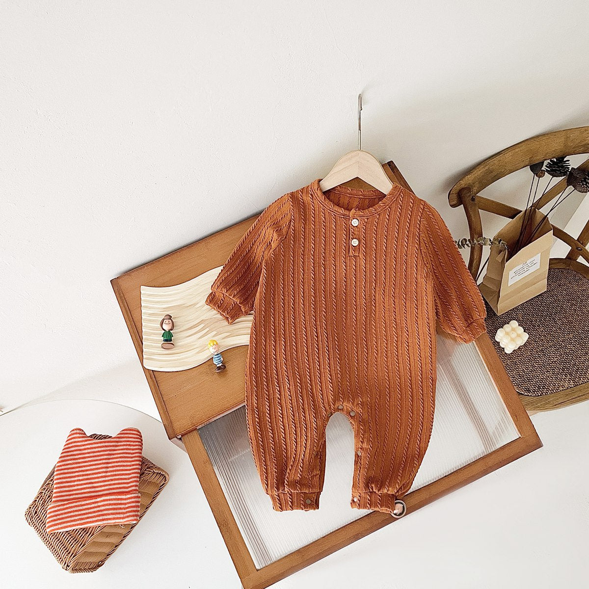 Baby Solid Color Long Sleeve Soft Cotton Romper in pink, apricot, and brown, showcasing its simple style and soft fabric.
