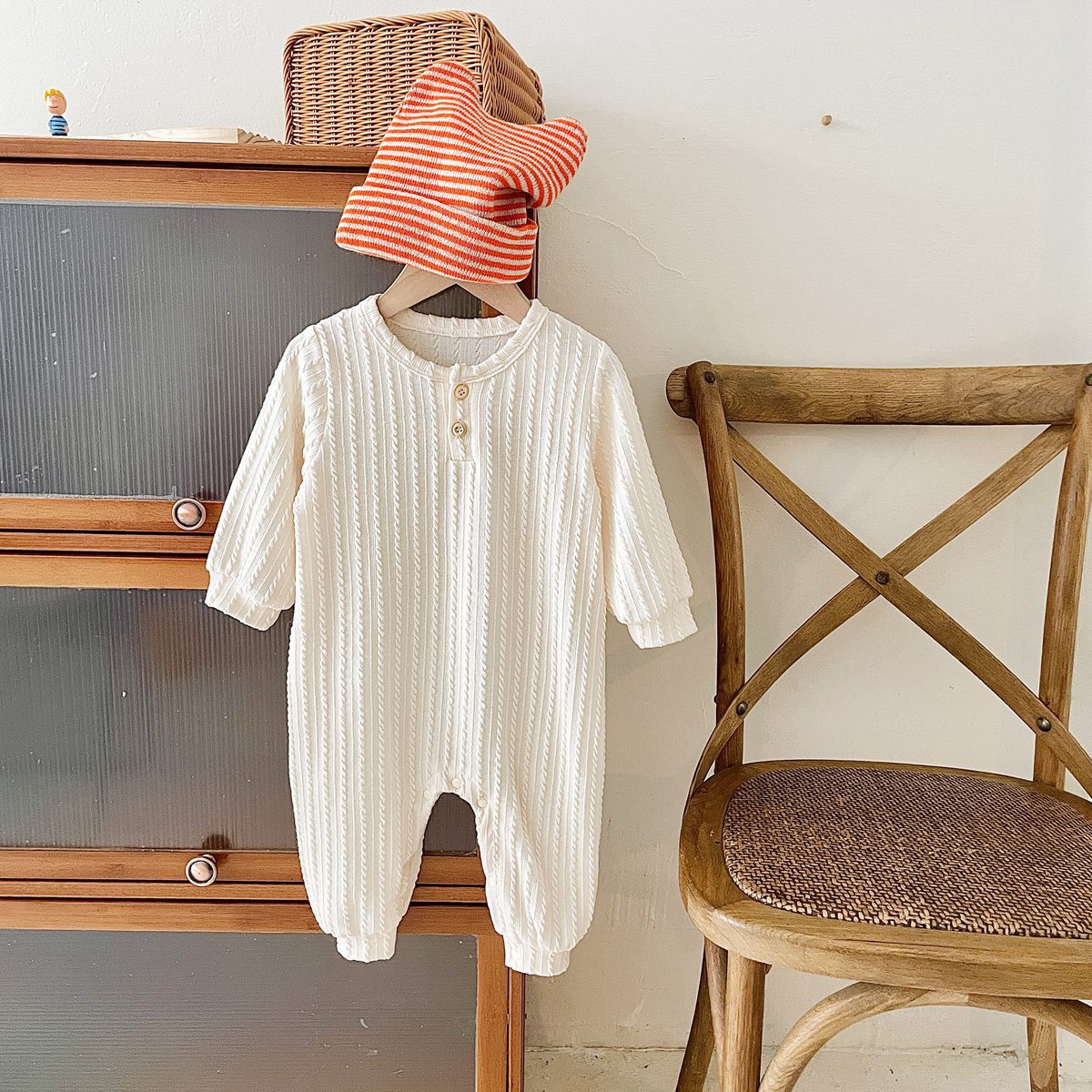 Baby Solid Color Long Sleeve Soft Cotton Romper in pink, apricot, and brown, showcasing its simple style and soft fabric.