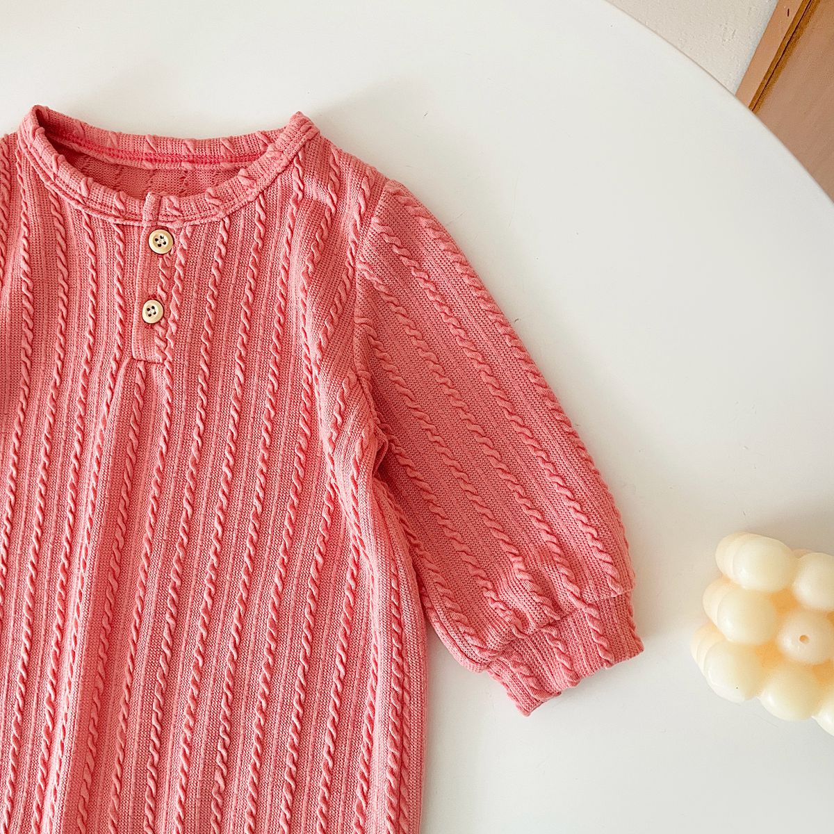 Baby Solid Color Long Sleeve Soft Cotton Romper in pink, apricot, and brown, showcasing its simple style and soft fabric.