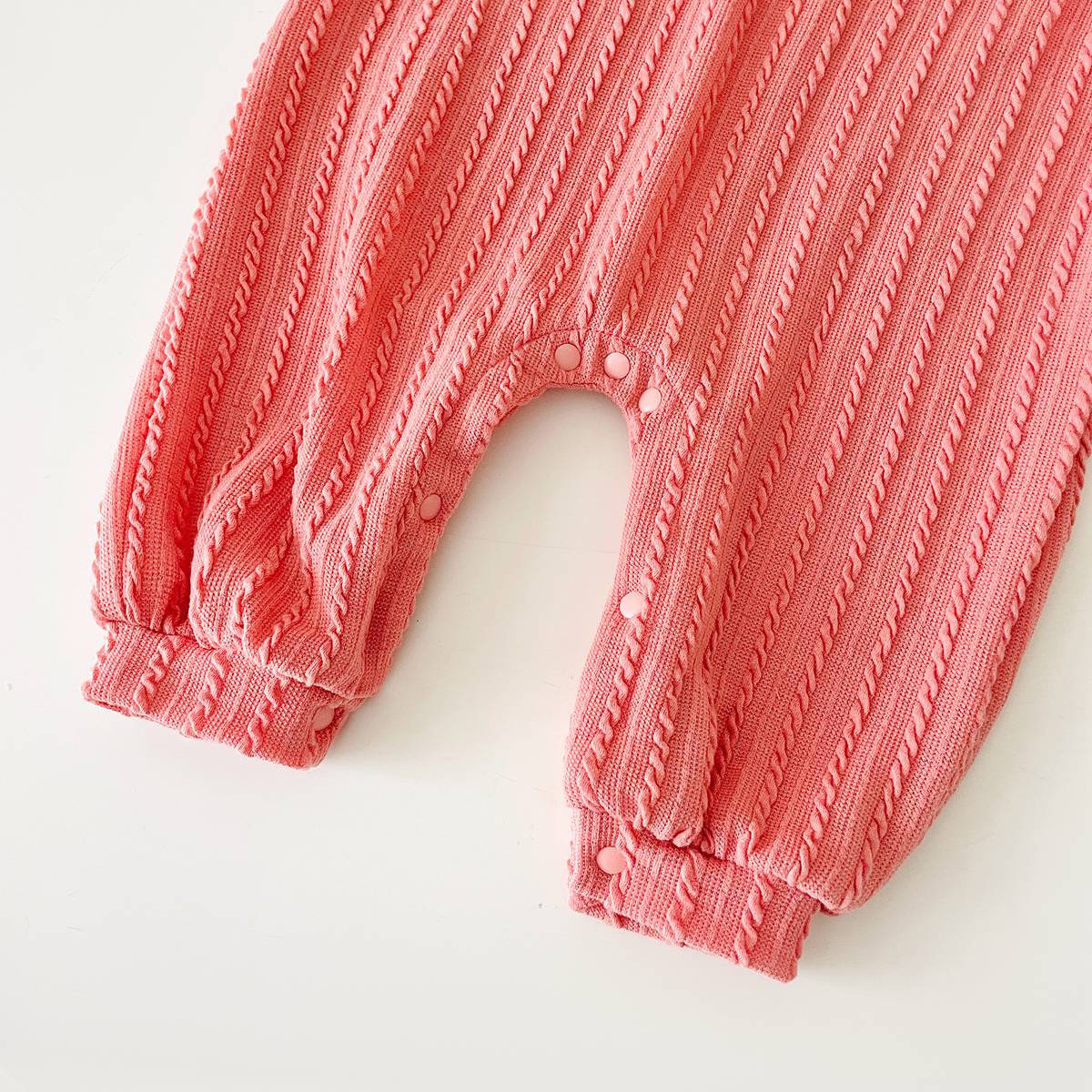 Baby Solid Color Long Sleeve Soft Cotton Romper in pink, apricot, and brown, showcasing its simple style and soft fabric.