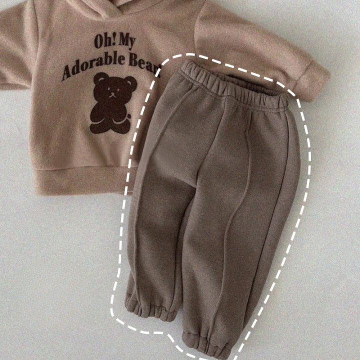 A pair of baby sweatpants in solid colors, showcasing soft fleece material, perfect for autumn wear.