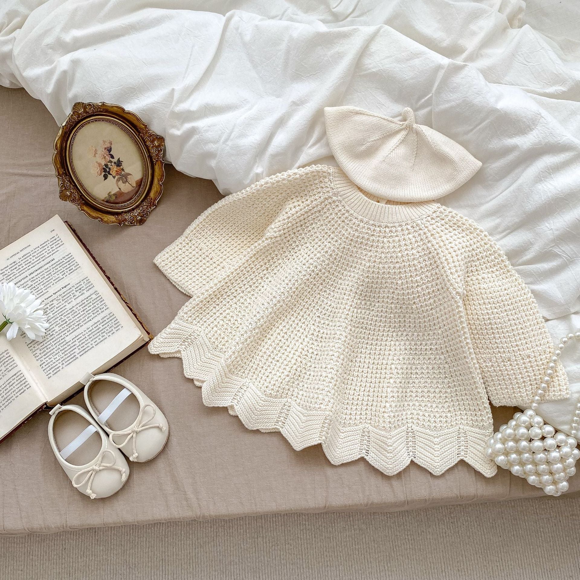 Baby toddler girl wearing a handmade apricot knitting solid pullover, showcasing a cozy and stylish design.