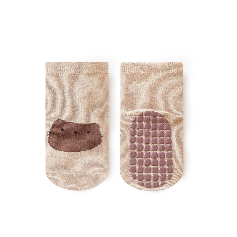 A pair of baby unisex cartoon socks in various colors, featuring a non-slip design and breathable fabric, perfect for infants and toddlers.