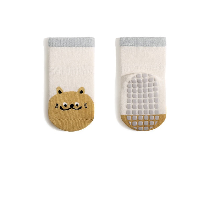 A pair of baby unisex breathable thermal socks featuring cartoon patchwork design in various colors, ideal for toddlers.