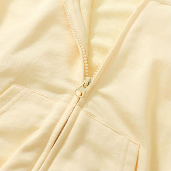 Baby unisex solid color cardigan set in apricot with cartoon shape design, made from soft cotton material.