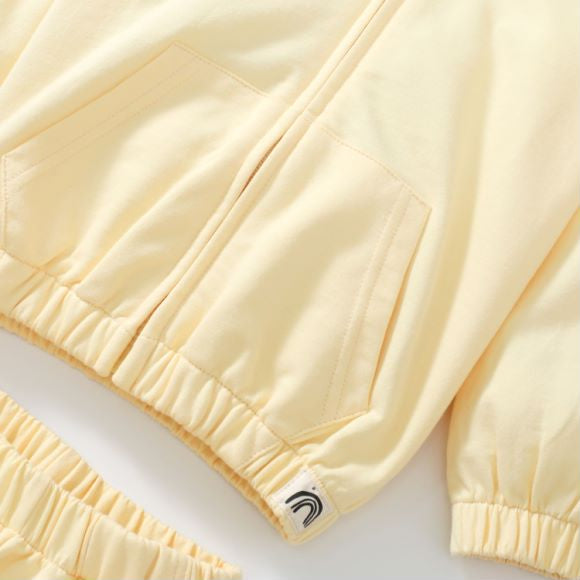 Baby unisex solid color cardigan set in apricot with cartoon shape design, made from soft cotton material.