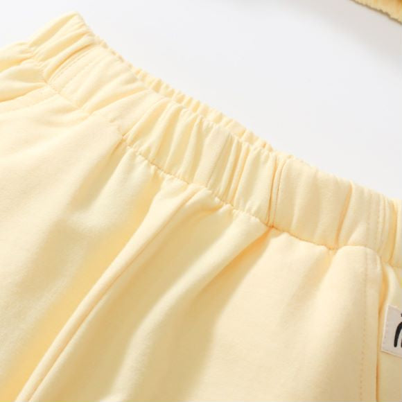 Baby unisex solid color cardigan set in apricot with cartoon shape design, made from soft cotton material.