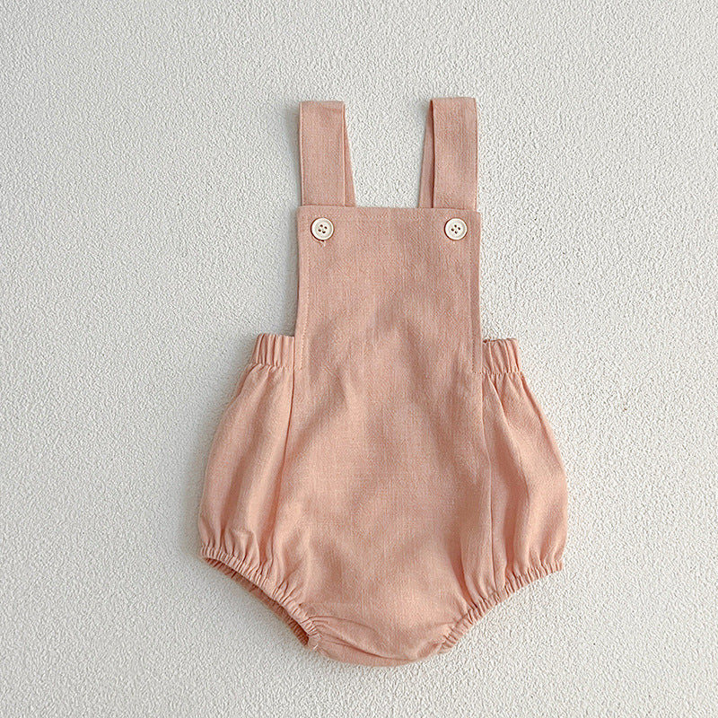 Baby wearing unisex solid color overalls in pink, showcasing a comfortable and stylish design suitable for spring and summer.