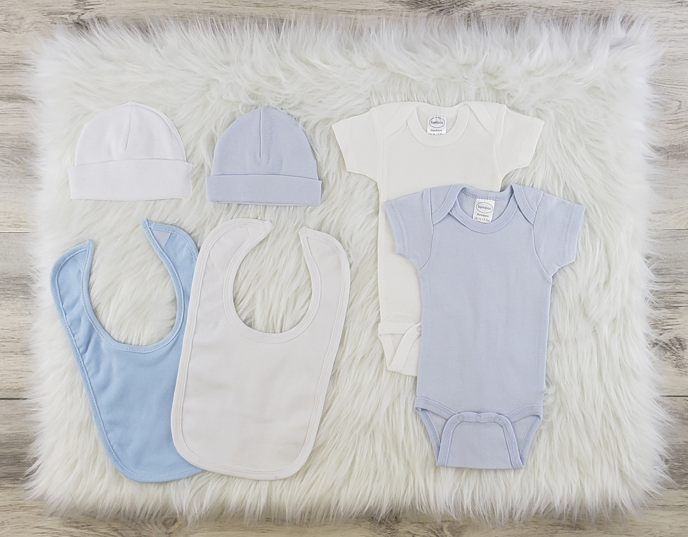 Bambini 6 Pc Layette Baby Clothes Set featuring soft cotton onesies, baby caps, and bibs in blue and white, perfect for newborns.