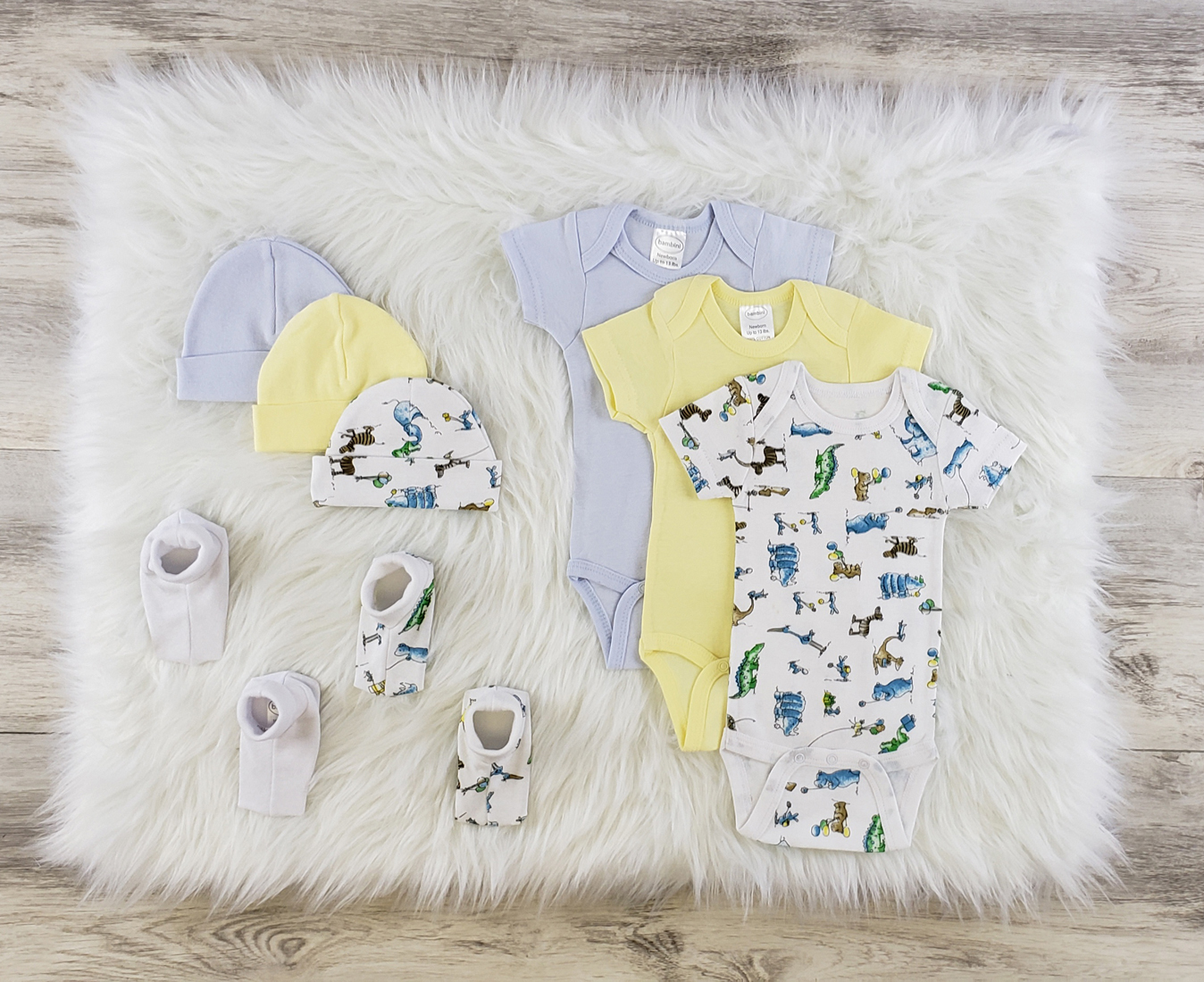 Bambini 8 Pc Layette Baby Clothes Set featuring soft cotton onesies, caps, and booties in blue and yellow colors, perfect for newborns.