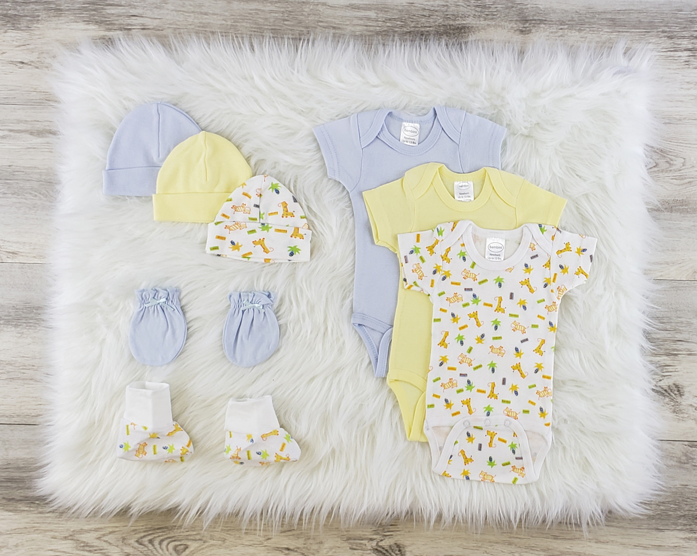 Bambini 8 Pc Layette Baby Clothes Set featuring soft cotton onesies, baby caps, booties, and mittens in a cozy arrangement.