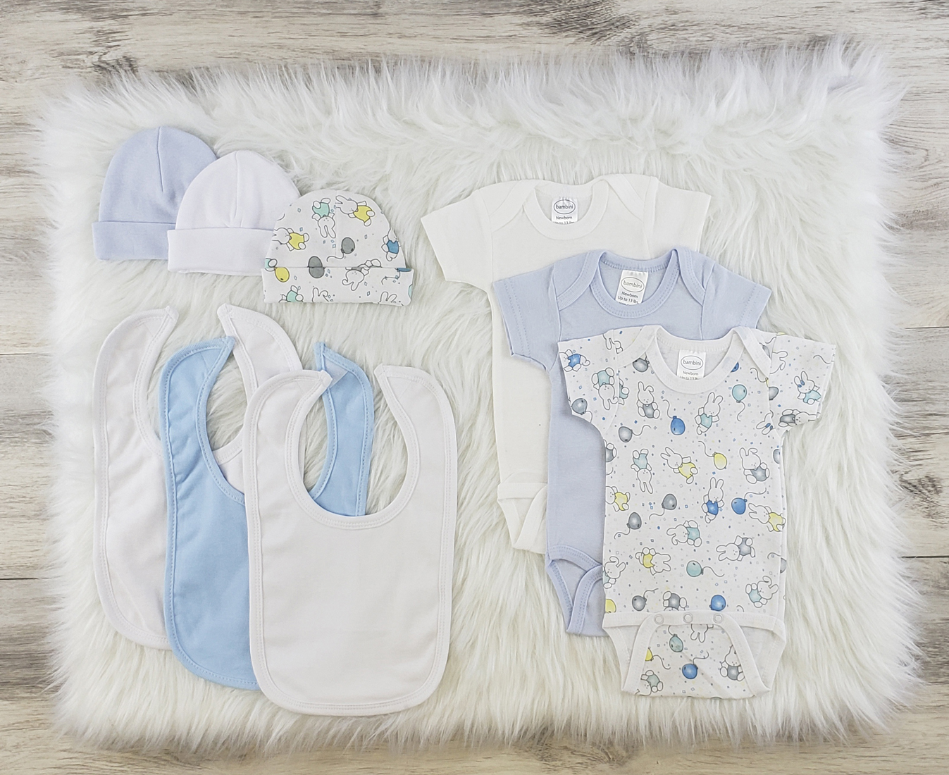 Bambini 9 Pc Layette Baby Clothes Set featuring soft cotton onesies, baby caps, and bibs in a variety of colors, perfect for newborns.