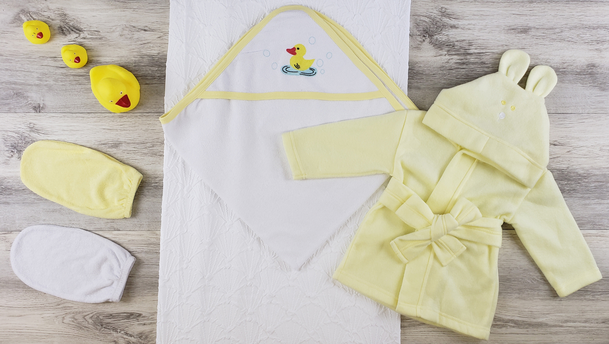 Bambini Hooded Towel, Bath Mittens, and Robe set featuring soft cotton fabric and a cozy design for newborns.