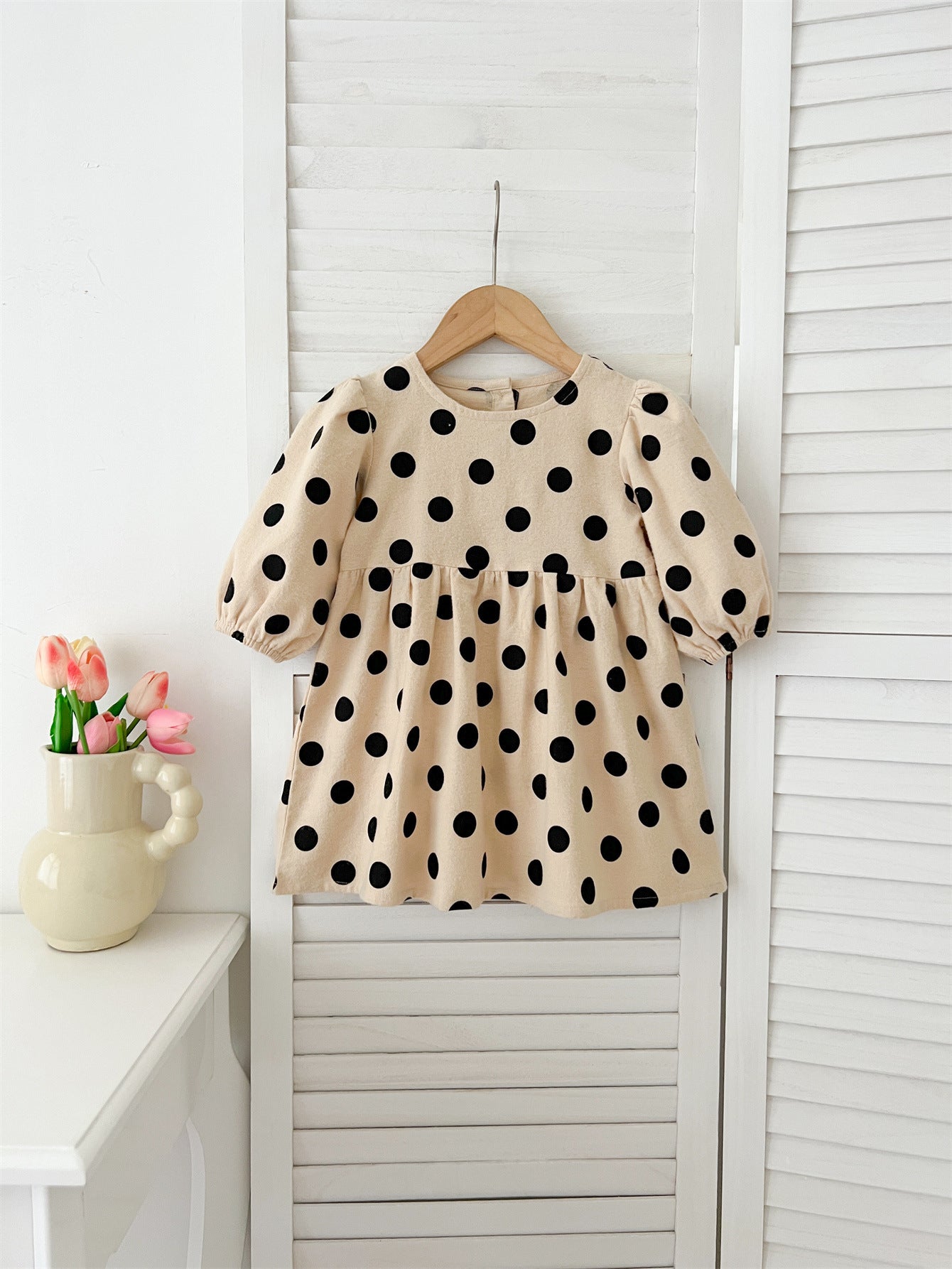 A khaki crew neck long sleeve top with a playful polka dot pattern, perfect for autumn and spring wear for girls.