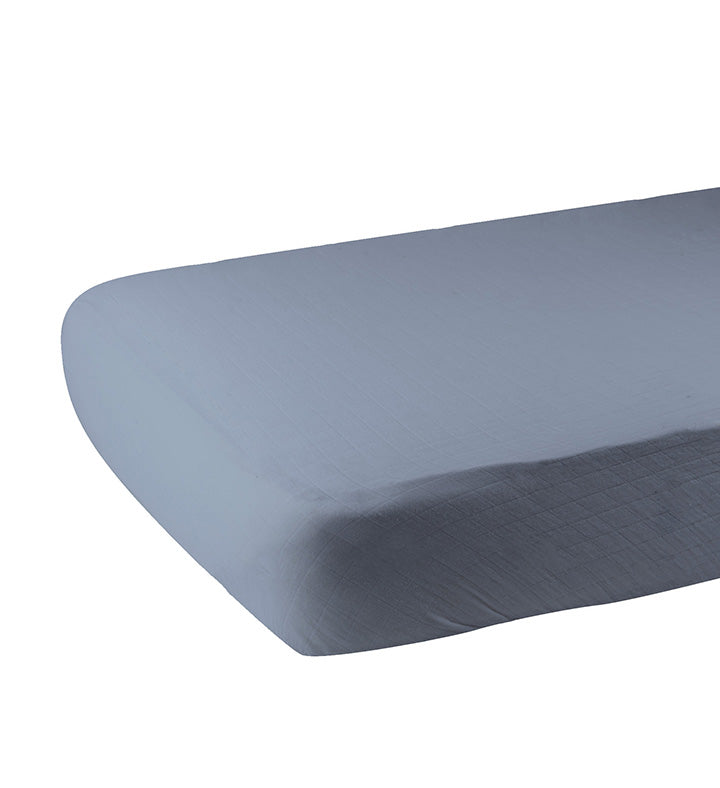 Blue Fog Newcastle Cotton Crib Sheet made from soft breathable cotton muslin, designed for standard crib mattresses.
