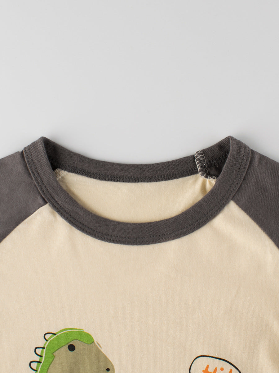 Boys’ Dinosaur and Lion Cartoon Print T-Shirt in beige cotton, featuring playful graphics for summer wear.