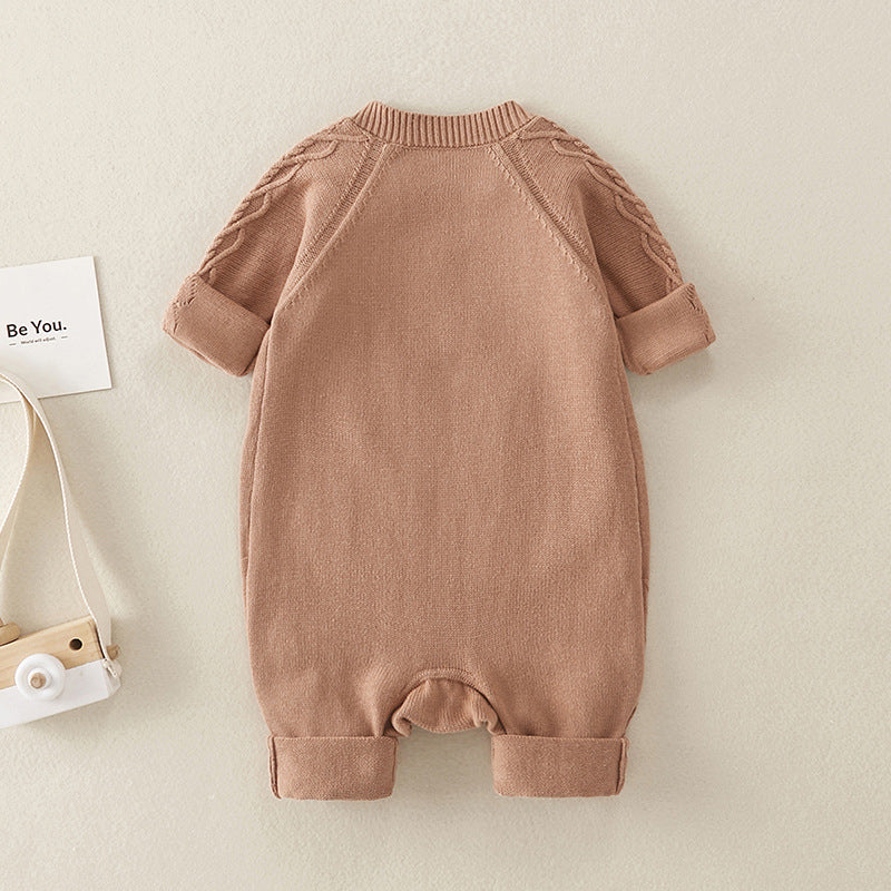 A soft brown knitted romper for babies, featuring long sleeves and a solid color design, perfect for both baby girls and boys.