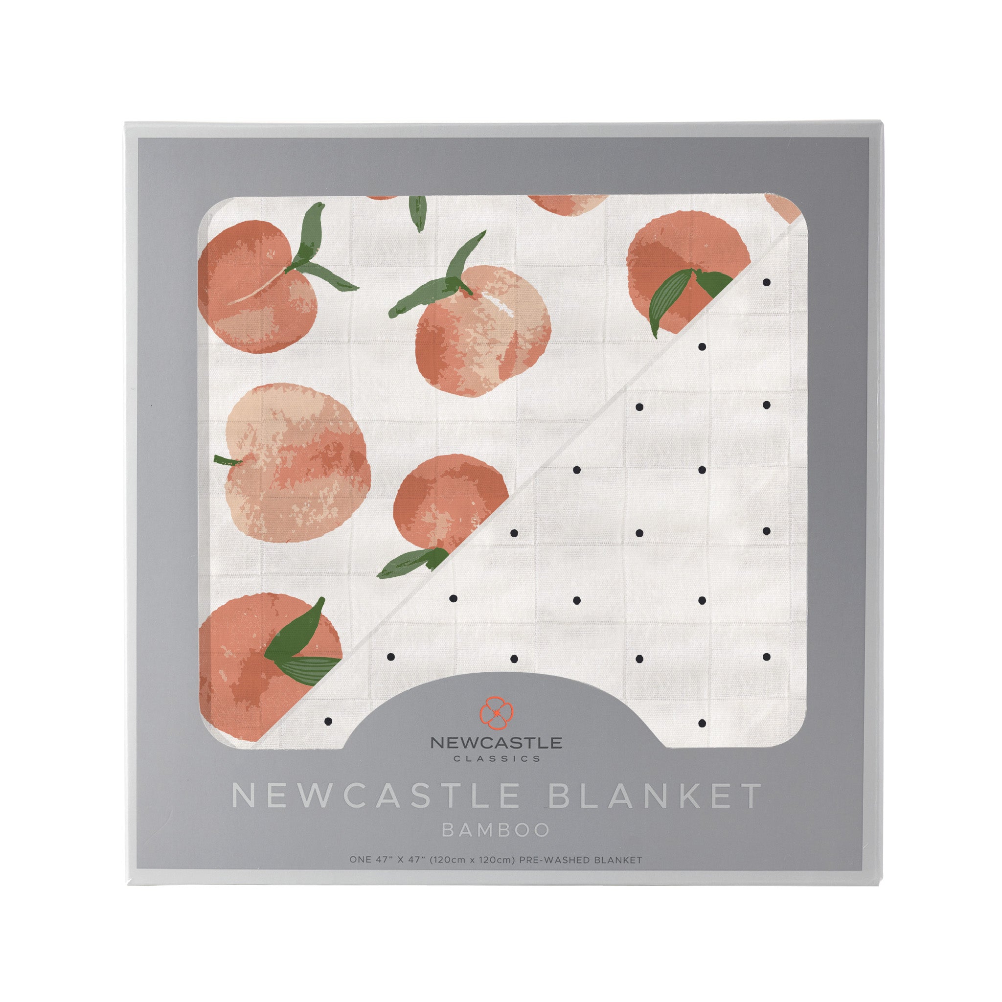 Carnelian Peaches and Black and White Polka Dot Newcastle Blanket, showcasing its soft bamboo muslin fabric and playful polka dot design.