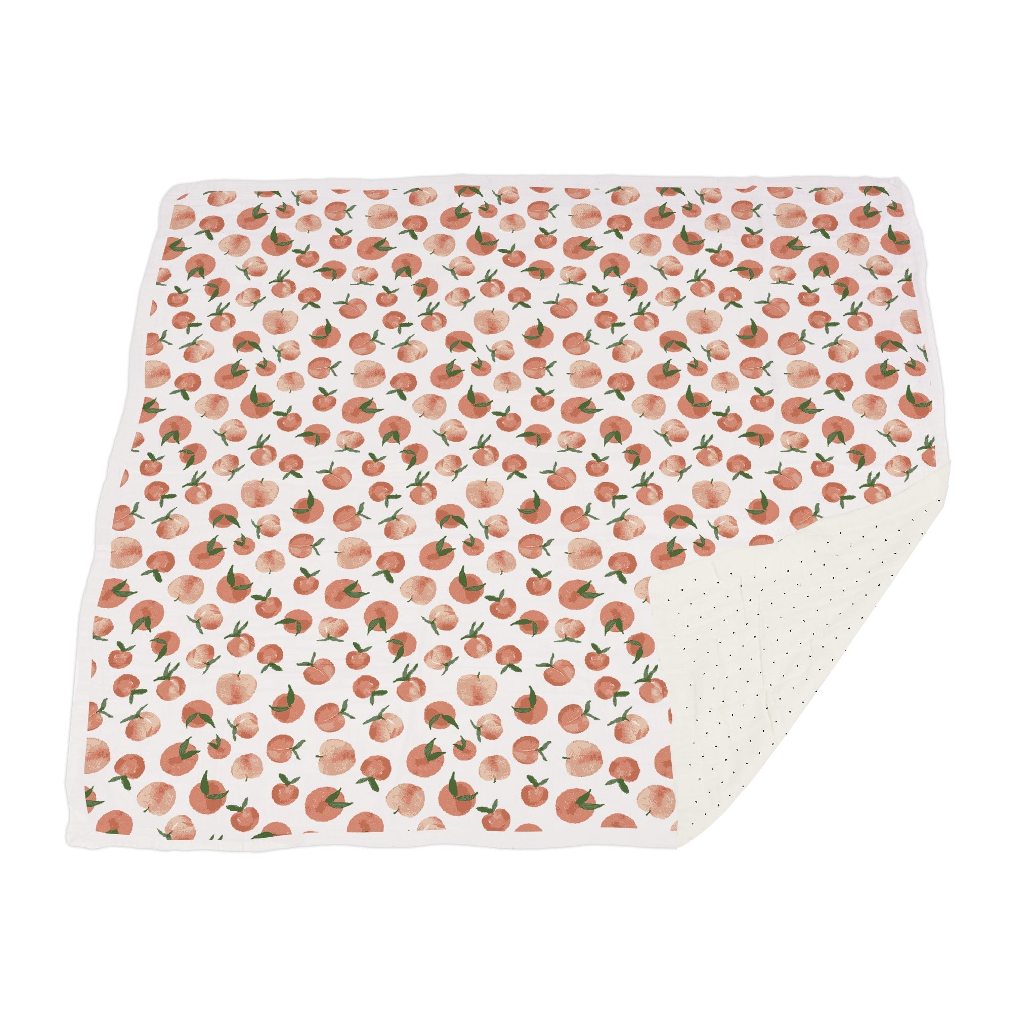 Carnelian Peaches and Black and White Polka Dot Newcastle Blanket, showcasing its soft bamboo muslin fabric and playful polka dot design.