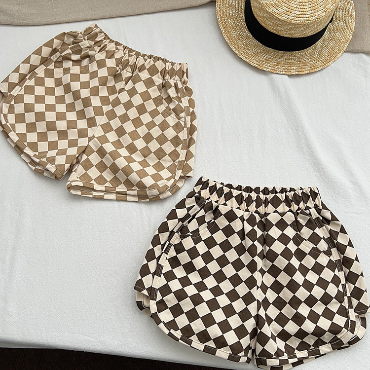 Checkerboard print pattern comfy shorts in khaki and brown colors, made from soft cotton, suitable for summer wear.