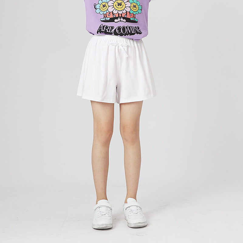 Children's solid color shorts in various colors, made from soft cotton, suitable for summer wear.