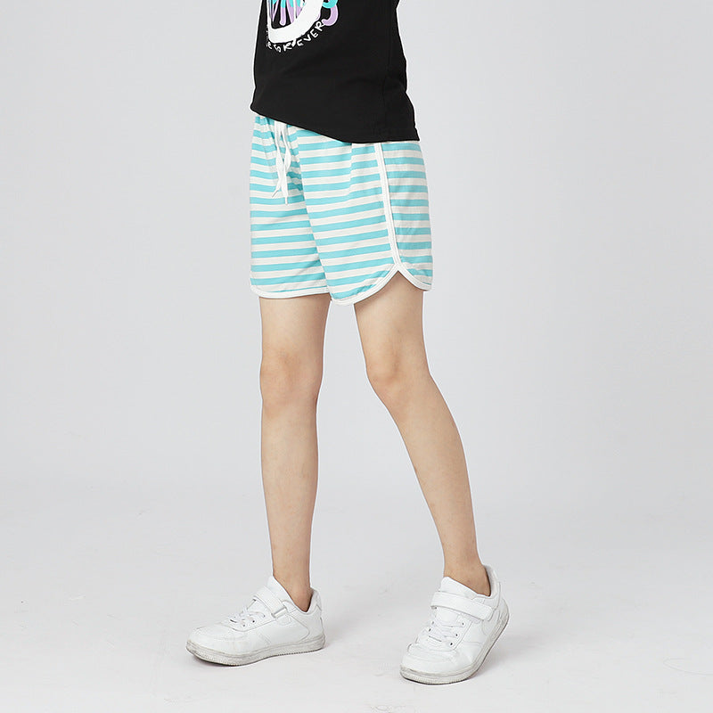Children's solid color shorts in various colors, made from soft cotton, suitable for summer wear.
