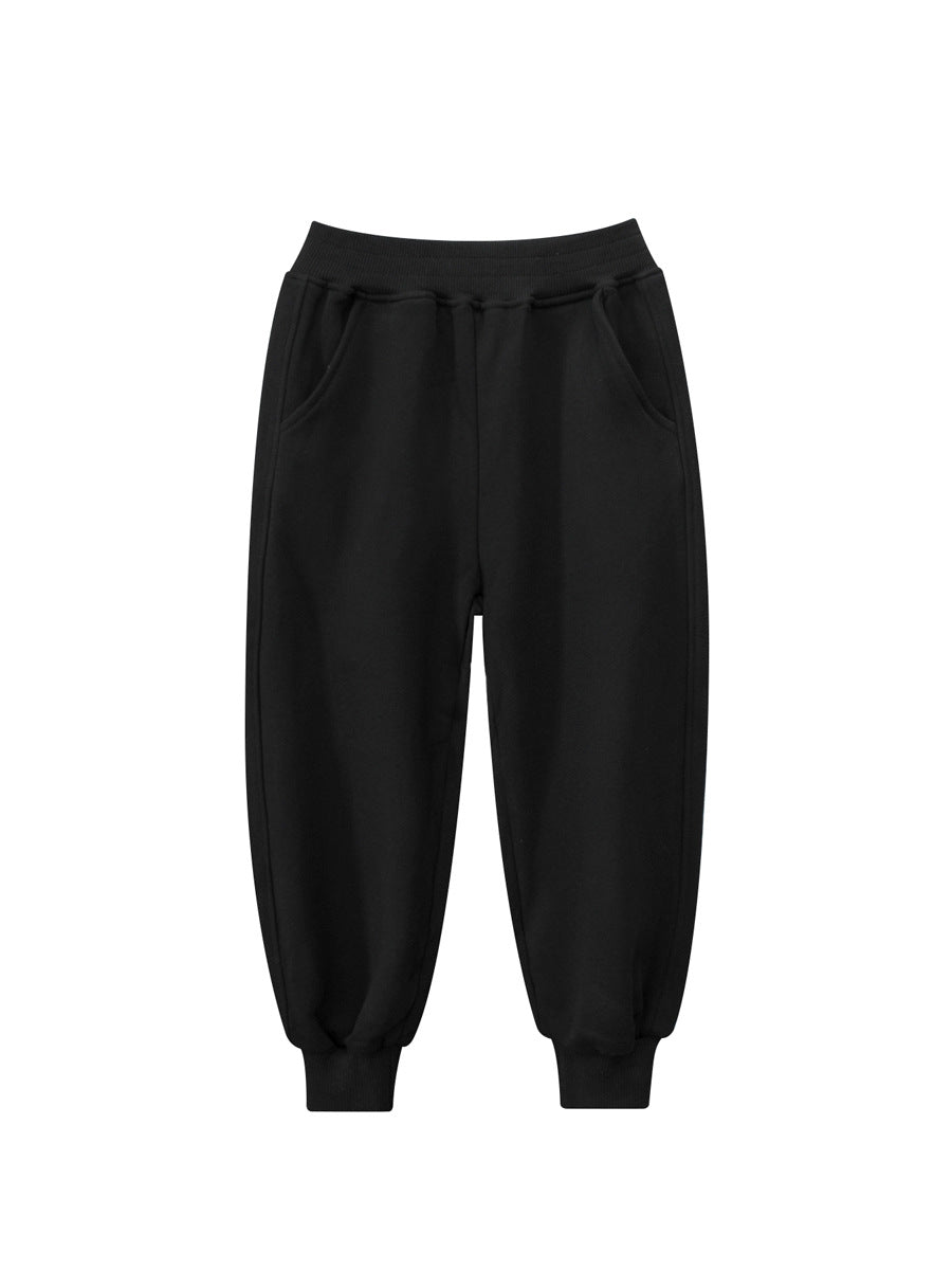 Children's solid color sportswear pants in black, navy blue, grey, and khaki, suitable for boys and girls.