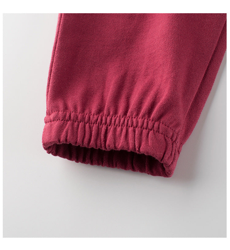 Children's cotton pants featuring a teddy bear cartoon design in red and grey colors, perfect for spring and summer wear.