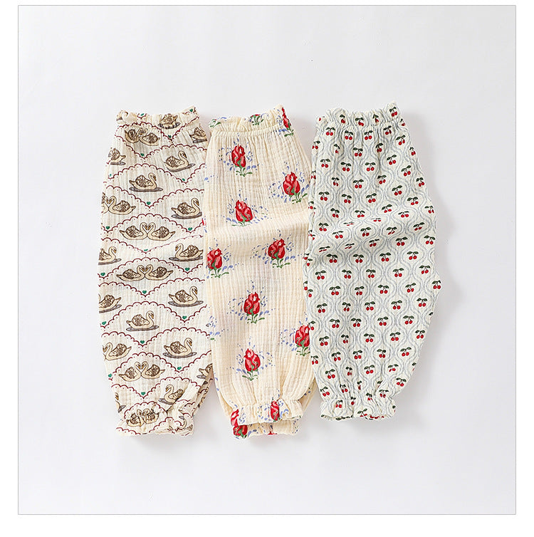 Children's summer outfit featuring floral, fruits, and animals patterns in white, beige, and apricot colors, made from breathable cotton.