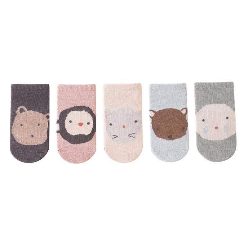 A colorful assortment of Comfy Cotton Cartoon Socks Non-Slip for kids, featuring various cartoon patterns and colors including pink, blue, green, grey, and beige.