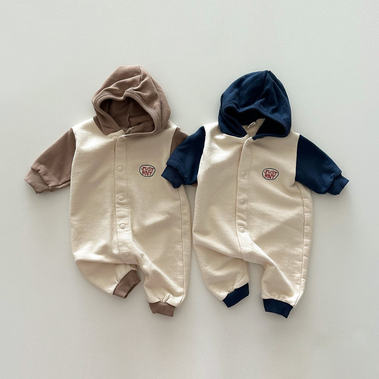 Contrast Color Design Soft Cotton Romper in navy blue and coffee for baby boys and girls, featuring a stylish patchwork design.